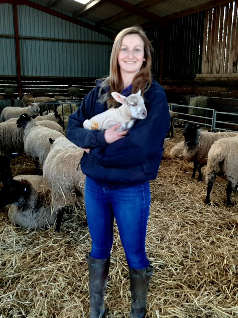 Mel Julian with a lamb